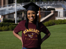 Photo of Akiyra Terry wearing a University of Minnesota t-shirt and a matching graduation cap